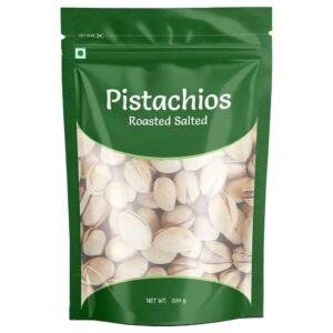 Premium roasted salted pista pistachios close up Open shell pistachios green kernels healthy snack Pistachio nuts jar aesthetic packaging India Crunchy roasted pista snack bowl dry fruits Best quality pistachios online India premium nuts